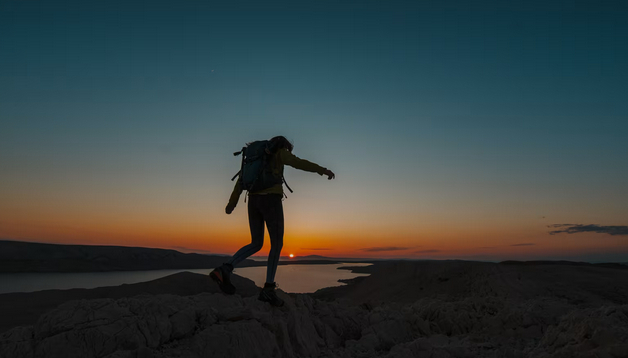 Trekker on a scenic trail with coastal views in Gozo
